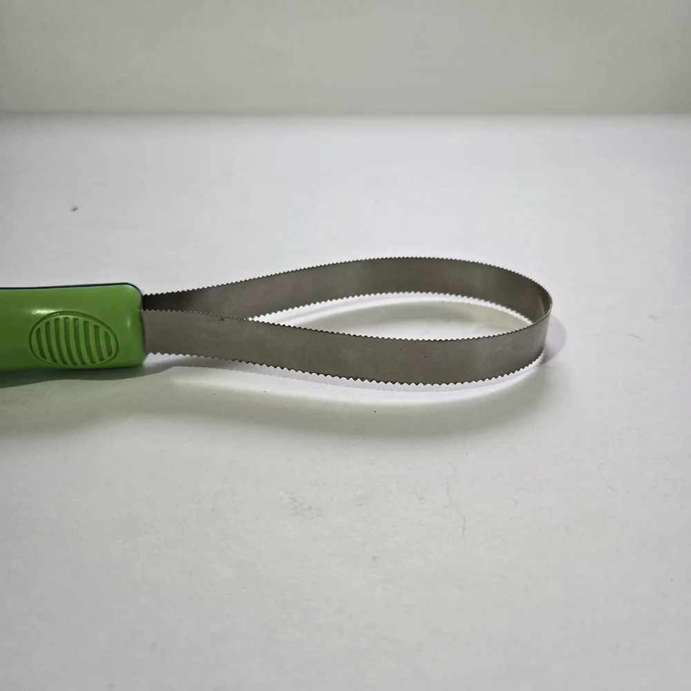 Green and Silver Grooming Tool